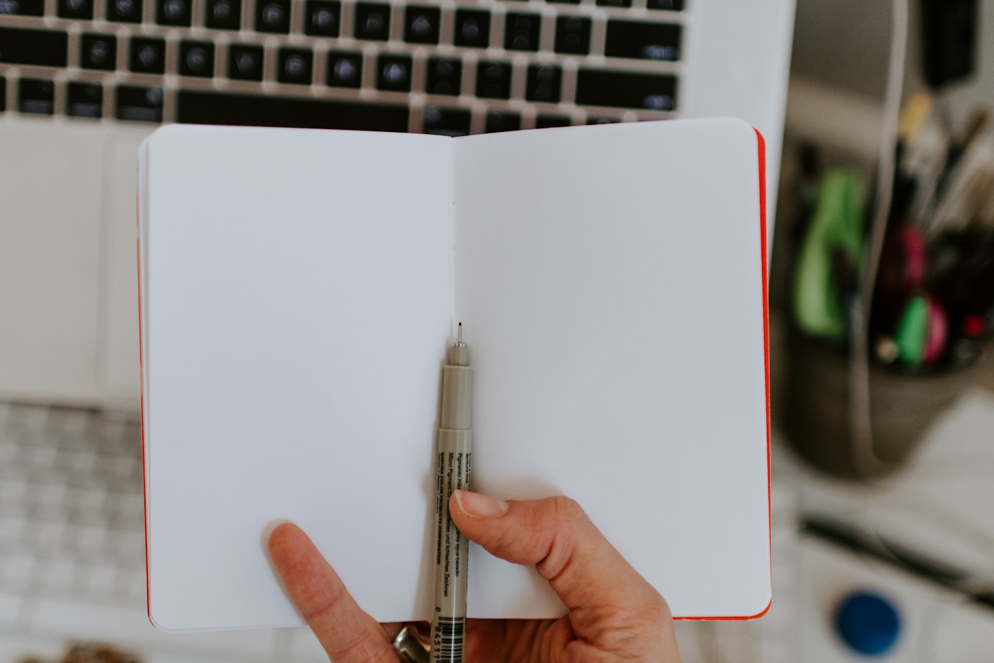 Empty notebook in front of a desk